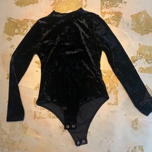 Black velvet high neck bodysuit.